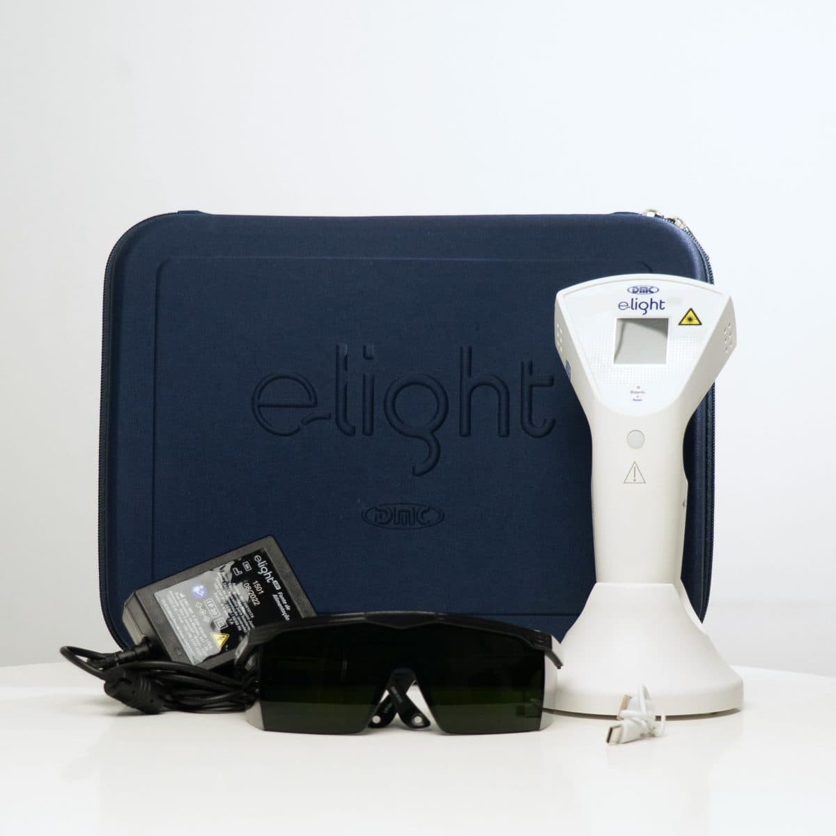 Equipo DMC E-Light con estuche y accesorios en el catálogo de Acolaser